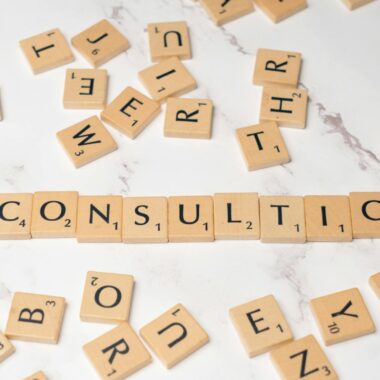 The word consulting spelled out in scrabble tiles